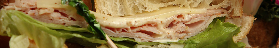 Eating Sandwich Vegetarian at Sweet Cane Cafe restaurant in Hilo, HI.